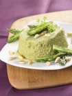 Green asparagus mousse with pine nuts — Stock Photo