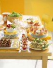 Selection of appetizers on plates — Stock Photo