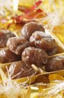 Candied chestnuts in case — Stock Photo