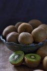 Fresh Kiwis in bowl — Stock Photo