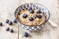 Closeup view of lupine porridge with dried fruits and blueberries — Stock Photo