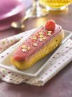 Raspberry Eclair with sugar coating — Stock Photo