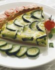 Zucchini savoury tart  on white plate — Stock Photo