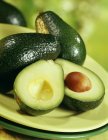 Fresh Avocados with halves — Stock Photo