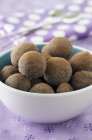Bowl of chocolate truffles — Stock Photo
