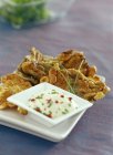 Closeup view of parasol mushroom fritters with a dip — Stock Photo