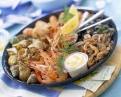Platter of seafood with cheese — Stock Photo