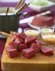 Raw Beef pieces for fondue — Stock Photo