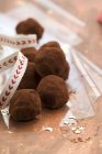 Chocolate truffles with ribbon — Stock Photo