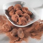 Chocolate truffles in bowl — Stock Photo