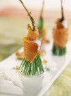 Closeup view of pine branches with salmon, nut sauce and dill — Stock Photo