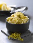 Tagliatelle pasta with lemon and olives — Stock Photo