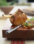Veal chop on desk — Stock Photo