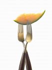 Closeup view of two forks with slice of melon — Stock Photo