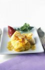 Grouper with curry and saffron sauce — Stock Photo