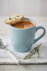Tomato soup in mug — Stock Photo