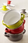 Closeup view of colored casserole dishes in stack — Stock Photo