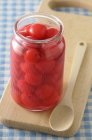 Jar of stewed cherries — Stock Photo