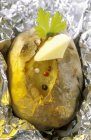 Baked potato with butter — Stock Photo