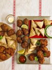 Top view of spicy snacks on platters — Stock Photo