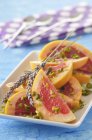 Pomelos with pistachios and oil — Stock Photo