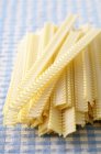 Dry uncooked parpadelle pasta — Stock Photo