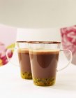 Cups of passion-fruit hot chocolate — Stock Photo