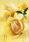 Lemon and sultana muffins on yellow — Stock Photo