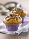 Muffins with chocolate frosting — Stock Photo