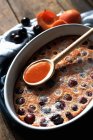 Closeup view of cherry Clafoutis with apricot Coulis — Stock Photo