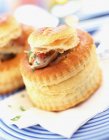 Chicken vol-au-vent on white and blue plate with napkin — Stock Photo