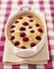Closeup view of raspberry Clafoutis in baking tray — Stock Photo