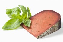 Tomme and fresh basil — Stock Photo