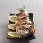 Lardelle trout on platter — Stock Photo