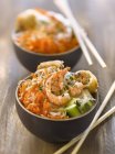 Shrimp Bo-Bun in black small pots and chopsticks — Stock Photo