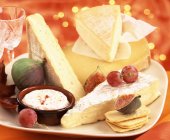 Assorted cheeses on plate — Stock Photo