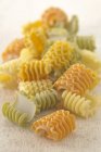 Dry uncooked colored radiatori pasta — Stock Photo