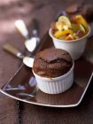 Chocolate souffl and salad — Stock Photo