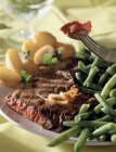 Beef steak and beans — Stock Photo