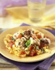 Linguine pasta with monkfish and vegetables — Stock Photo
