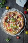 Homemade pizza with cherry tomatoes — Stock Photo