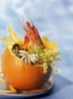 Seafood salad in orange — Stock Photo