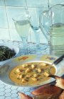 Closeup view of creamy fish soup with croutons — Stock Photo
