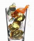 Closeup view of glass full of empty cans and trash — Stock Photo