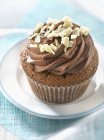 Chocolate cupcake on plate — Stock Photo