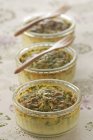 Closeup view of herbal Flans with forks — Stock Photo