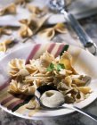 Farfalle pasta with white pesto — Stock Photo