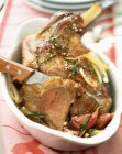 Roasted leg of lamb with herbs — Stock Photo