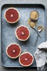 Halved Grapefruits with brown sugar — Stock Photo
