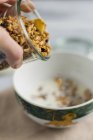 Granola being poured — Stock Photo
